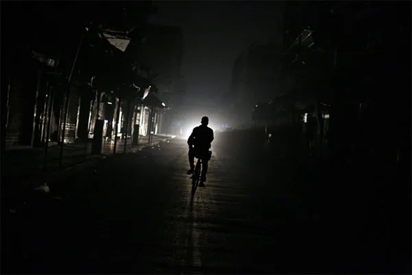 Man Cycles Through A Suburb